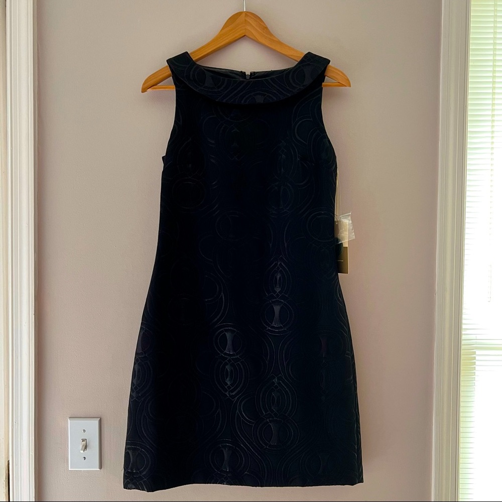 Black sleeveless cocktail dress with wide collar